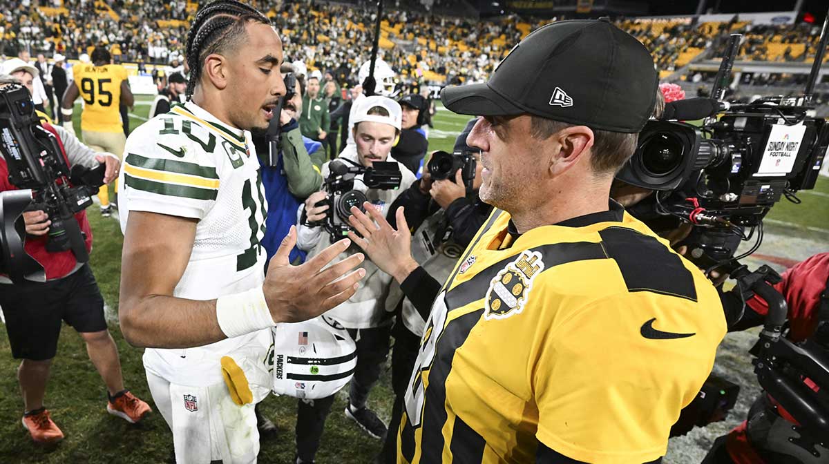 Pittsburgh Steelers quarterback Aaron Rodgers (8) and Green Bay Packers quarterback Jordan Love (10) shake hands after the game at Acrisure Stadium.