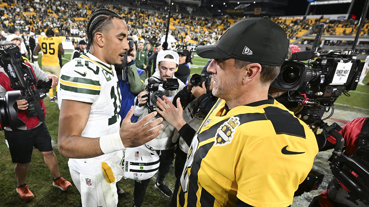 Pittsburgh Steelers quarterback Aaron Rodgers (8) and Green Bay Packers quarterback Jordan Love (10) shake hands after the game at Acrisure Stadium.