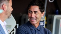 San Diego Padres general manager AJ Preller, right, talks with CEO Erik Greupner in the dugout before the game against the St. Louis Cardinals at Petco Park.