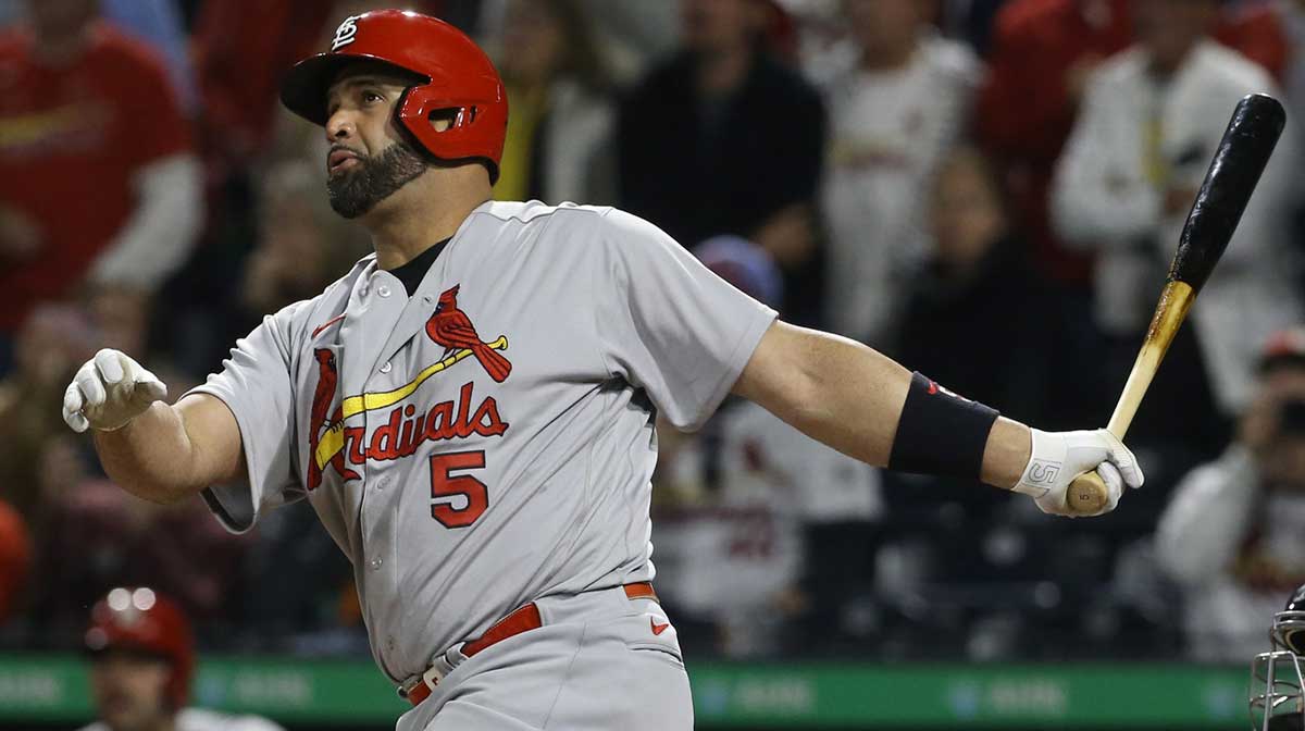 St. Louis Cardinals designated hitter Albert Pujols (5) hits a two run home run against the Pittsburgh Pirates during the sixth inning at PNC Park. The home run was the 703rd of Pujols career and the two runs batted in moved him into second place on the all-time MLB RBI list with 2216 runs batted in.