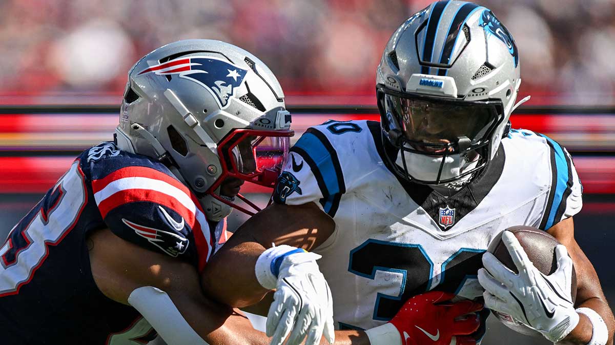 Sep 28, 2025; Foxborough, Massachusetts, USA; New England Patriots linebacker Christian Elliss (53) tackles Carolina Panthers running back Chuba Hubbard (30) during the second half at Gillette Stadium. Mandatory Credit: Brian Fluharty-Imagn Images