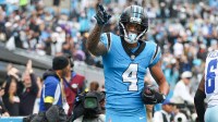 Carolina Panthers wide receiver Tetairoa McMillan (4) celebrates a touchdown during the second quarter against the Dallas Cowboys at Bank of America Stadium.