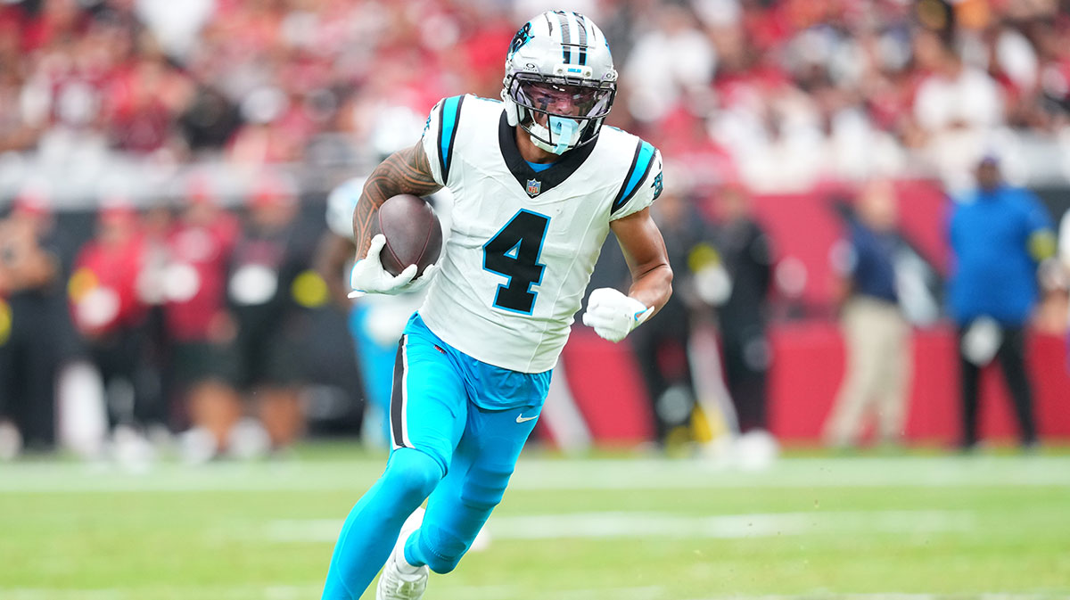  Carolina Panthers wide receiver Tetairoa McMillan (4) runs with the ball during the first quarter against the Arizona Cardinals at State Farm Stadium.