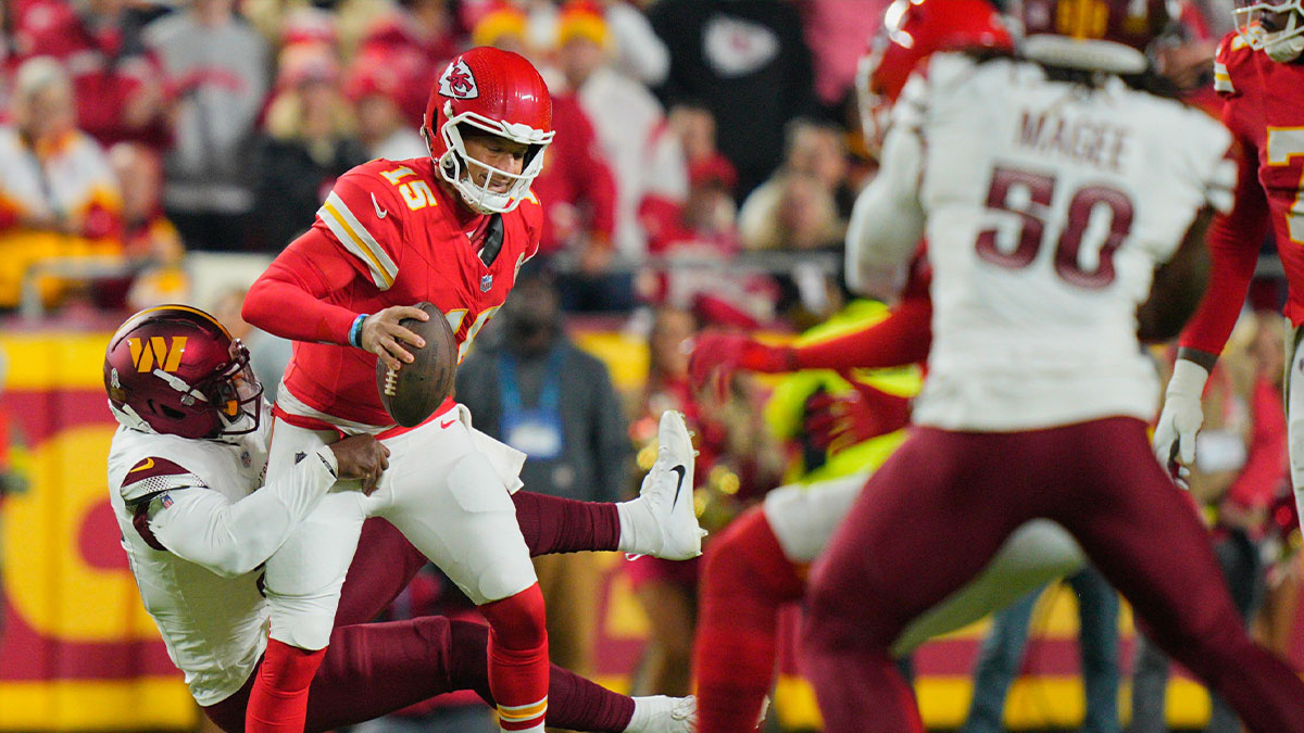 Washington Commanders defensive end Jacob Martin (55) sacks Kansas City Chiefs quarterback Patrick Mahomes (15) during the first quarter of the game at GEHA Field at Arrowhead Stadium.