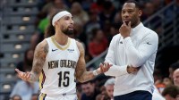 New Orleans Pelicans guard Jose Alvarado (15) talks with head coach Willie Green during the second half against the Boston Celtics at Smoothie King Center.