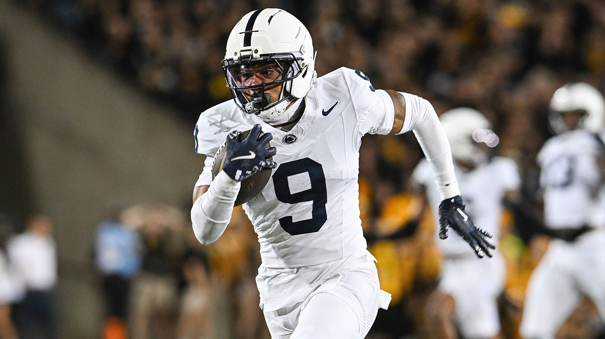Penn State Nittany Lions cornerback Elliot Washington II (9) returns a blocked field goal attempt by Iowa Hawkeyes kicker Drew Stevens (not pictured) 35 yards for a touchdown on the final play of the second quarter at Kinnick Stadium.