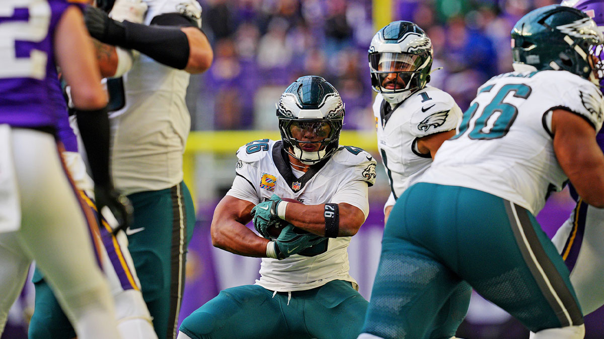 Philadelphia Eagles running back Saquon Barkley (26) protects the ball during the second half against the Minnesota Vikings at U.S. Bank Stadium.