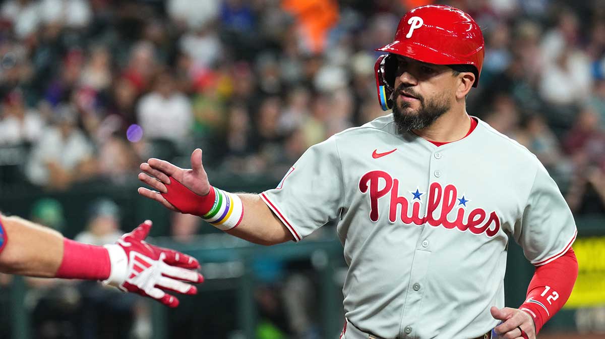 Philadelphia Phillies outfielder Kyle Schwarber (12) celebrates after scoring a run against the Arizona Diamondbacks during the first inning at Chase Field.