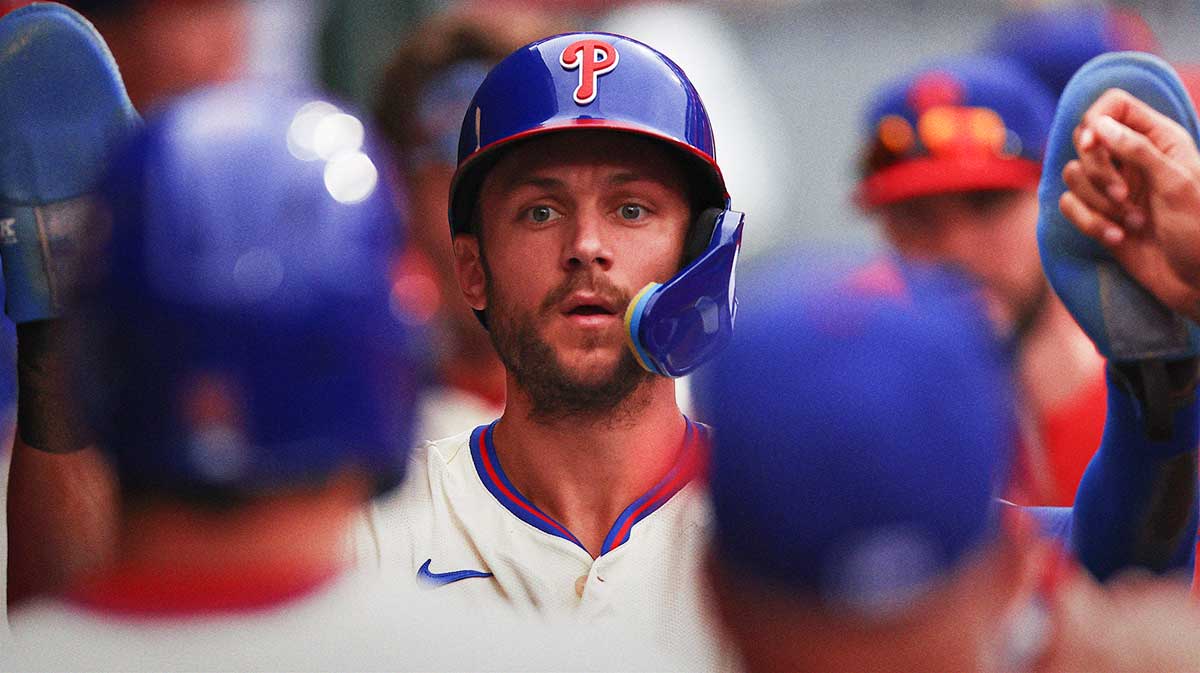 Philadelphia Phillies shortstop Trea Turner (7) high fives teammates after scoring during the first inning against the Seattle Mariners at Citizens Bank Park.