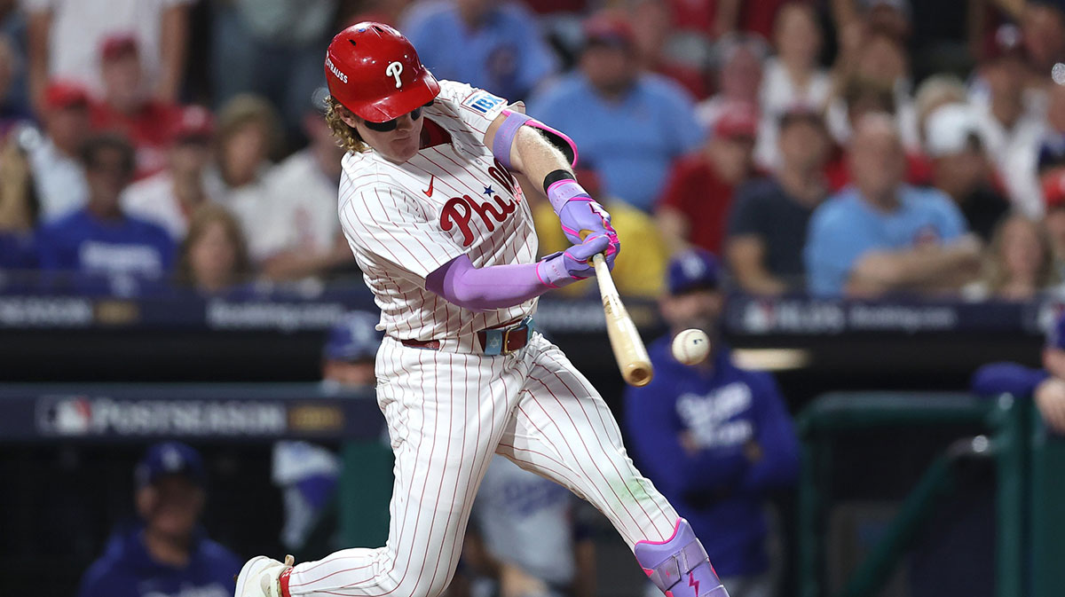 Philadelphia Phillies left fielder Harrison Bader (2) hits an RBI sacrifice fly against the Los Angeles Dodgers in the second inning during game one of the NLDS round for the 2025 MLB playoffs at Citizens Bank Park.