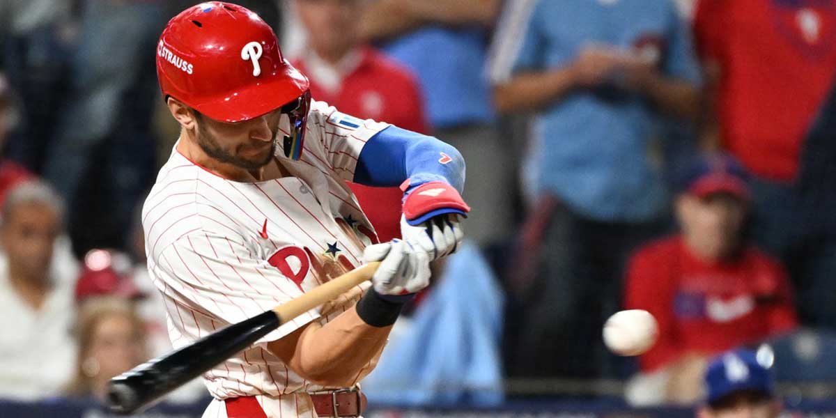 Philadelphia Phillies shortstop Trea Turner (7) hits an RBI single against the Los Angeles Dodgers in the eighth inning during game two of the NLDS round for the 2025 MLB playoffs at Citizens Bank Park.