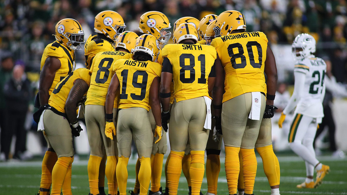 Pittsburgh Steelers quarterback Aaron Rodgers (8) calls a play in the huddle during the first half against the against the Green Bay Packers at Acrisure Stadium in Pittsburgh, PA on October 26, 2025.
