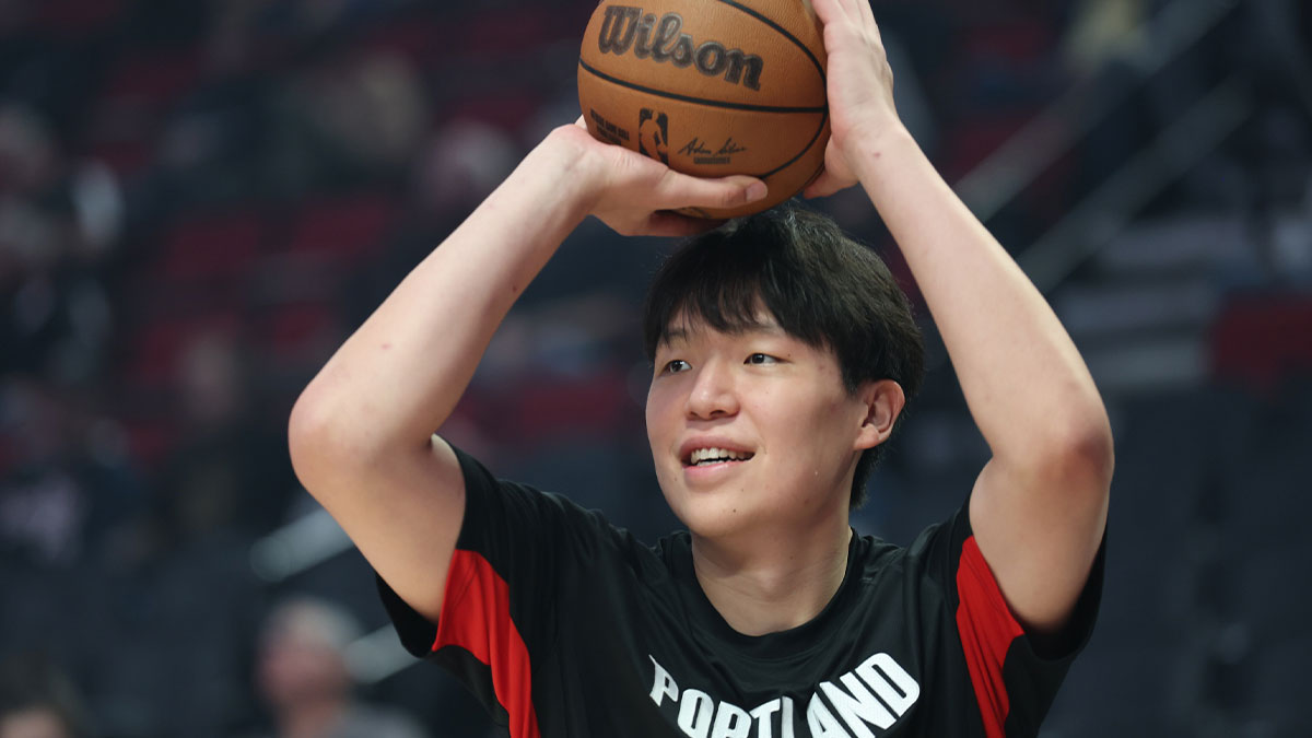 Portland Trail Blazers center Yang Hansen (17) shoots the ball during warm ups before playing in a game against Sacramento Kings at Moda Center