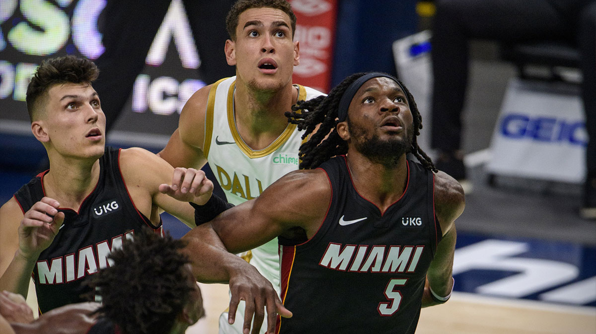 Miami Heat guard Tyler Herro (14) and forward Precious Achiuwa (5) and Dallas Mavericks center Dwight Powell (7) in action during the game between the Dallas Mavericks and the Miami Heat at the American Airlines Center.