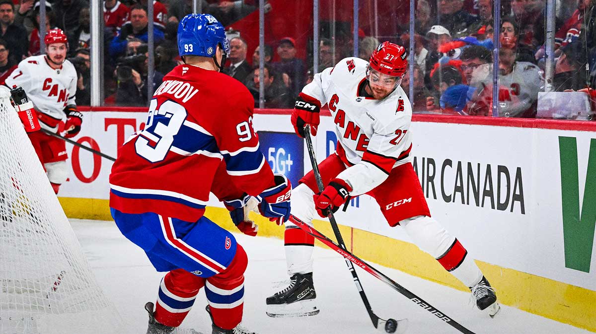 Carolina Hurricanes center Tyson Jost (27) defends the puck against Montreal Canadiens right wing Ivan Demidov (93) in the first period at Bell Centre.