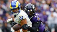 Baltimore Ravens safety Malaki Starks (24) tackles Los Angeles Rams wide receiver Puka Nacua (12) during the second quarter of the game at M&T Bank Stadium.