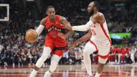 Toronto Raptors forward RJ Barrett (9) tries to dribble around Houston Rockets forward Josh Okogie (20) during the first half at Scotiabank Arena.