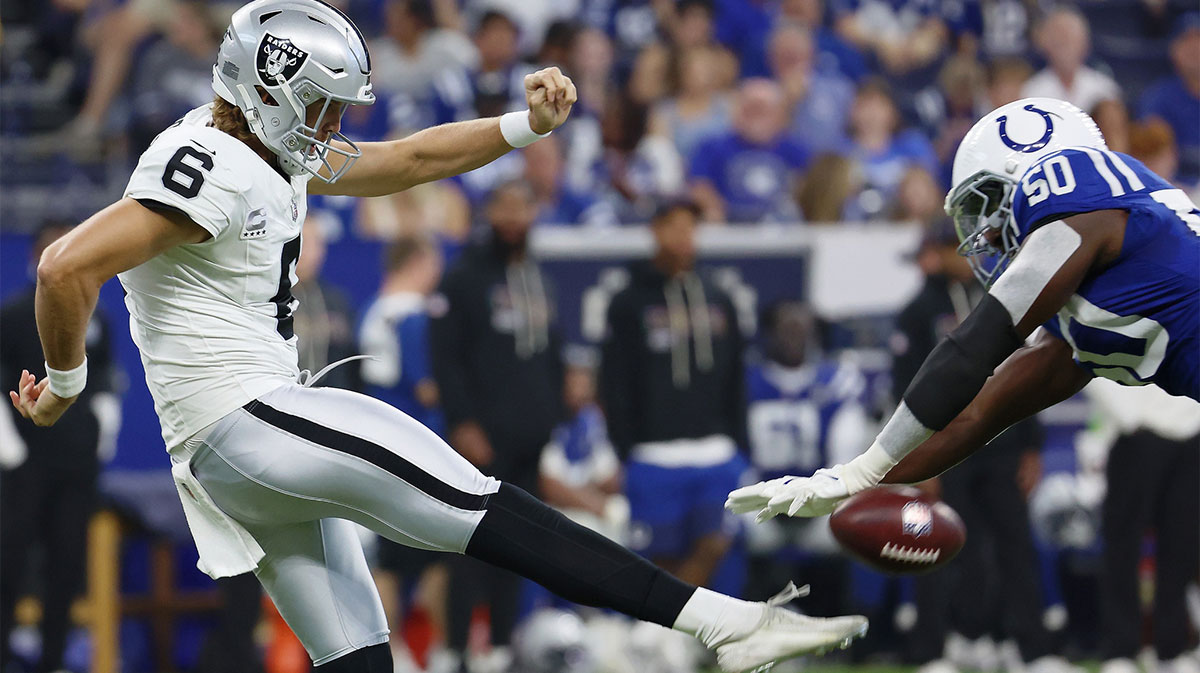 Indianapolis Colts linebacker Segun Olubi (50) blocks a punt by Las Vegas Raiders punter AJ Cole (6) during the second quarter at Lucas Oil Stadium.
