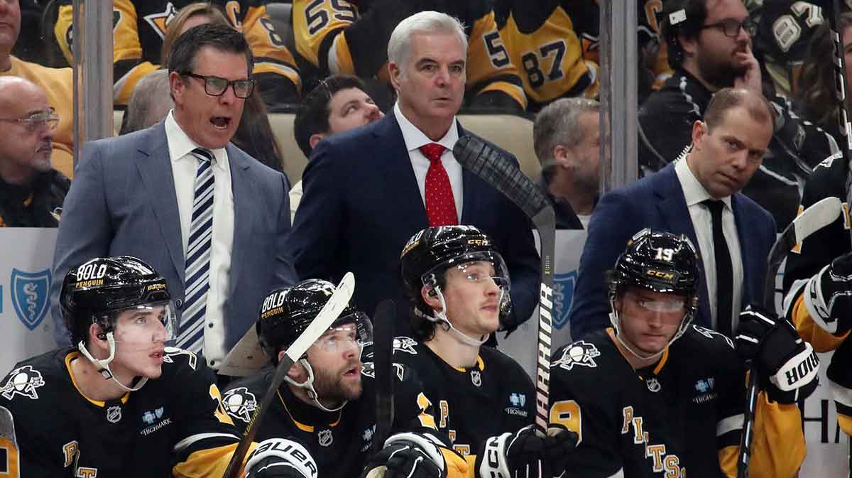 Pittsburgh Penguins head coach Mike Sullivan (rear left) reacts on the bench against the Los Angeles Kings during the third period at PPG Paints Arena.