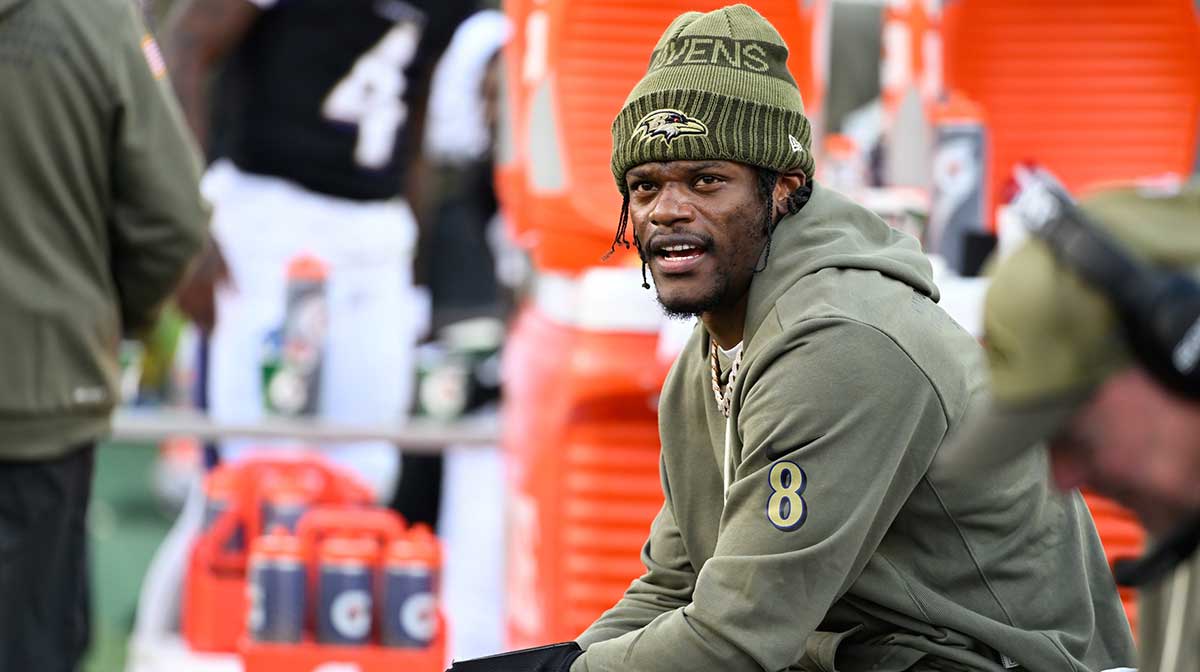 Baltimore Ravens quarterback Lamar Jackson (8) looks on from the sideline during the fourth quarter against the Chicago Bears at M&T Bank Stadium.