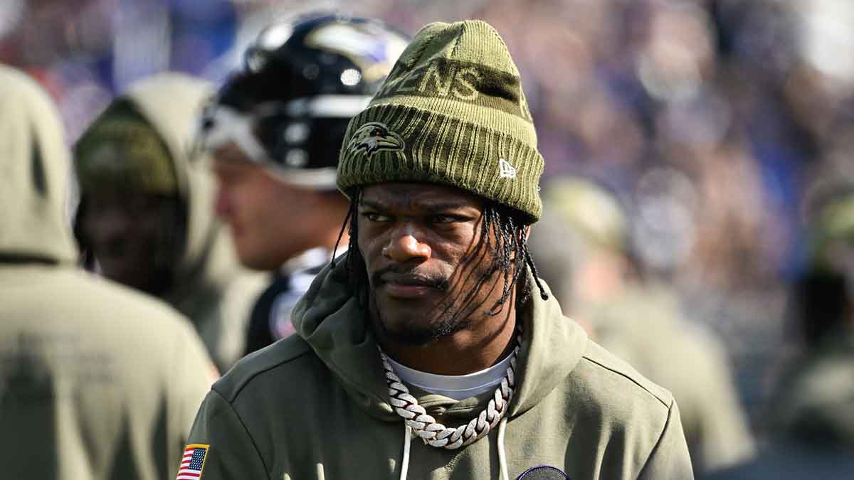 Baltimore Ravens quarterback Lamar Jackson (8) looks on from the sideline during the first quarter against the Chicago Bears at M&T Bank Stadium.