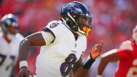 Baltimore Ravens quarterback Lamar Jackson (8) scrambles during the first half against the Kansas City Chiefs at GEHA Field at Arrowhead Stadium.