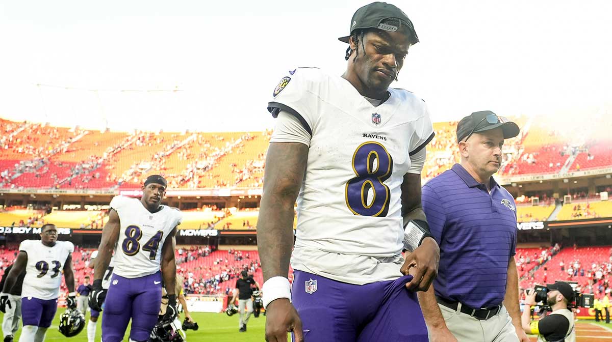 Baltimore Ravens quarterback Lamar Jackson (8) leaves the field after a game against the Kansas City Chiefs at GEHA Field at Arrowhead Stadium.