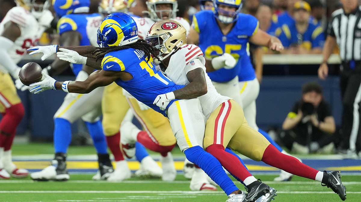 Los Angeles Rams wide receiver Davante Adams (17) makes a catch against San Francisco 49ers cornerback Renardo Green (0) during the first half at SoFi Stadium.