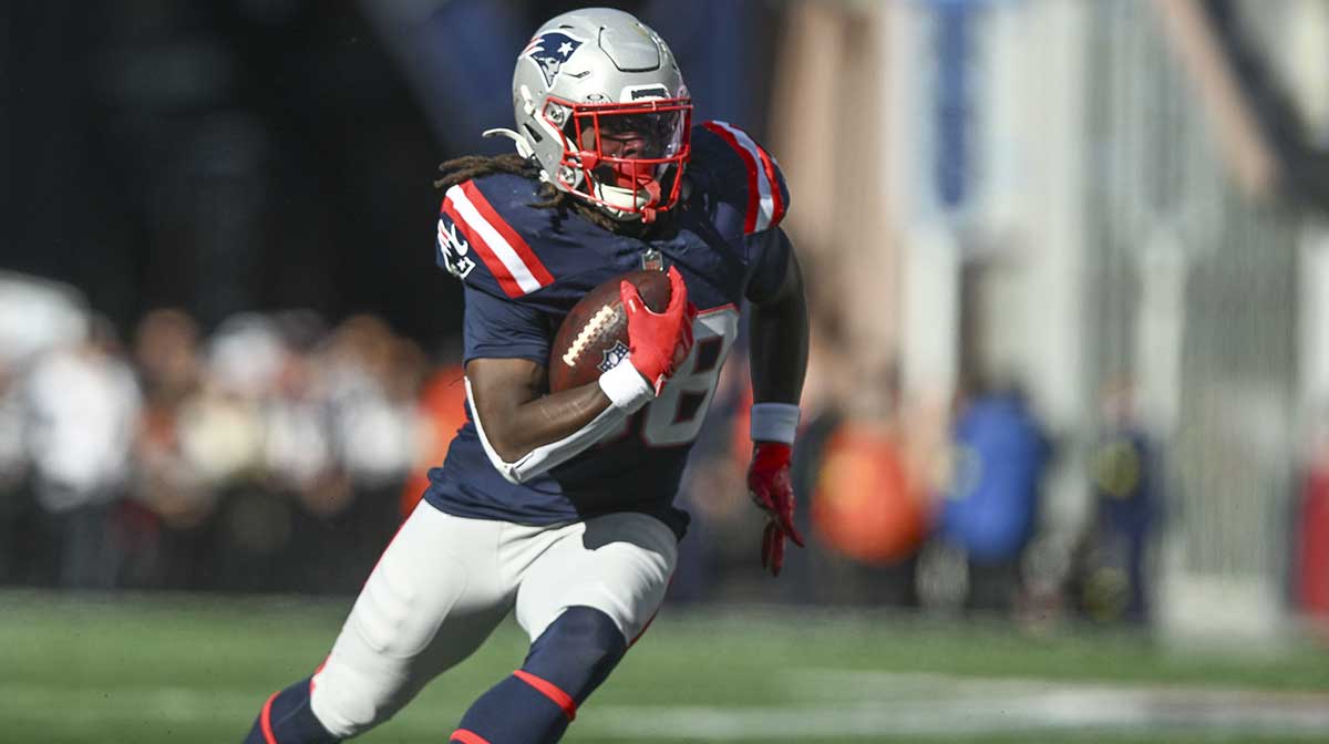 New England Patriots running back Rhamondre Stevenson (38) runs with the ball during the third quarter against the Cleveland Browns at Gillette Stadium.