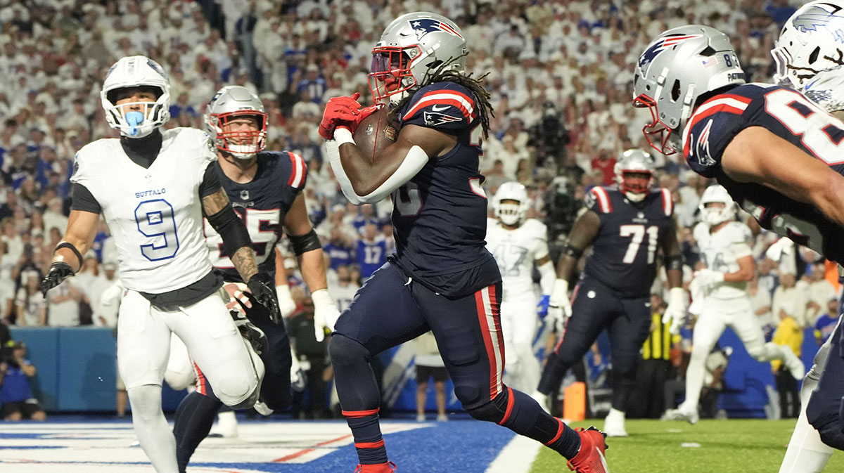 New England Patriots running back Rhamondre Stevenson (38) rushes for a touchdown against the Buffalo Bills during the second half at Highmark Stadium.