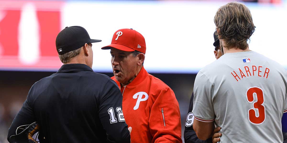 Philadelphia Phillies manager Rob Thomson (59) argues with home plate umpire Brian Walsh (120) after first baseman Bryce Harper (3) was ejected in the first inning against the Colorado Rockies.