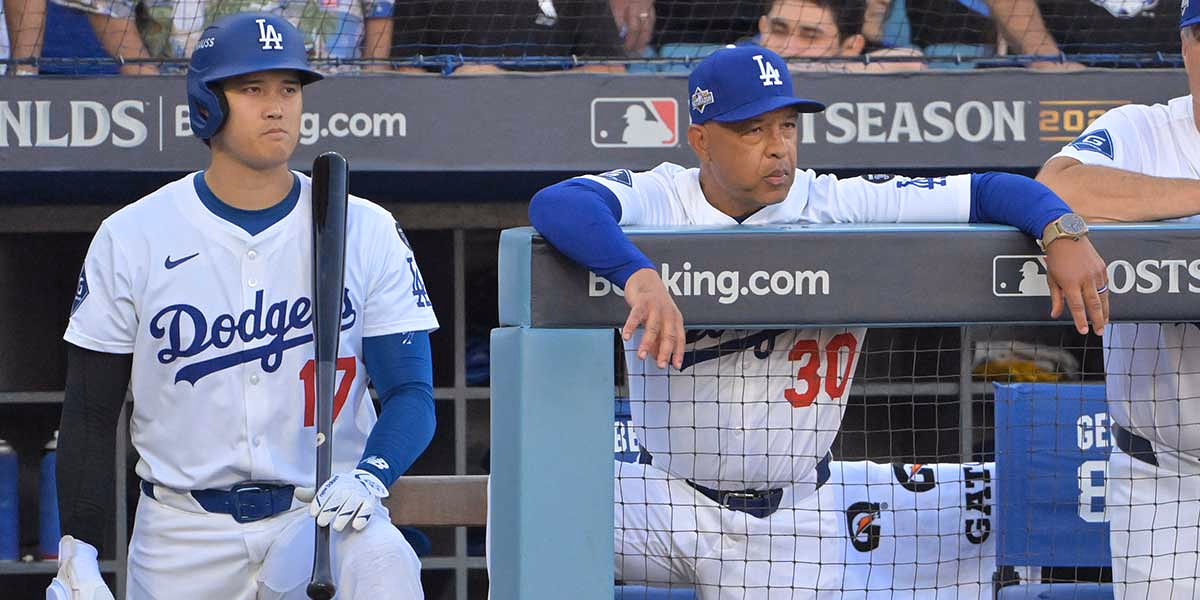 Los Angeles Dodgers designated hitter Shohei Ohtani (17) and Los Angeles Dodgers manager Dave Roberts (30) in the seventh inning against the Philadelphia Phillies during game four of the NLDS round for the 2025 MLB playoffs at Dodger Stadium.