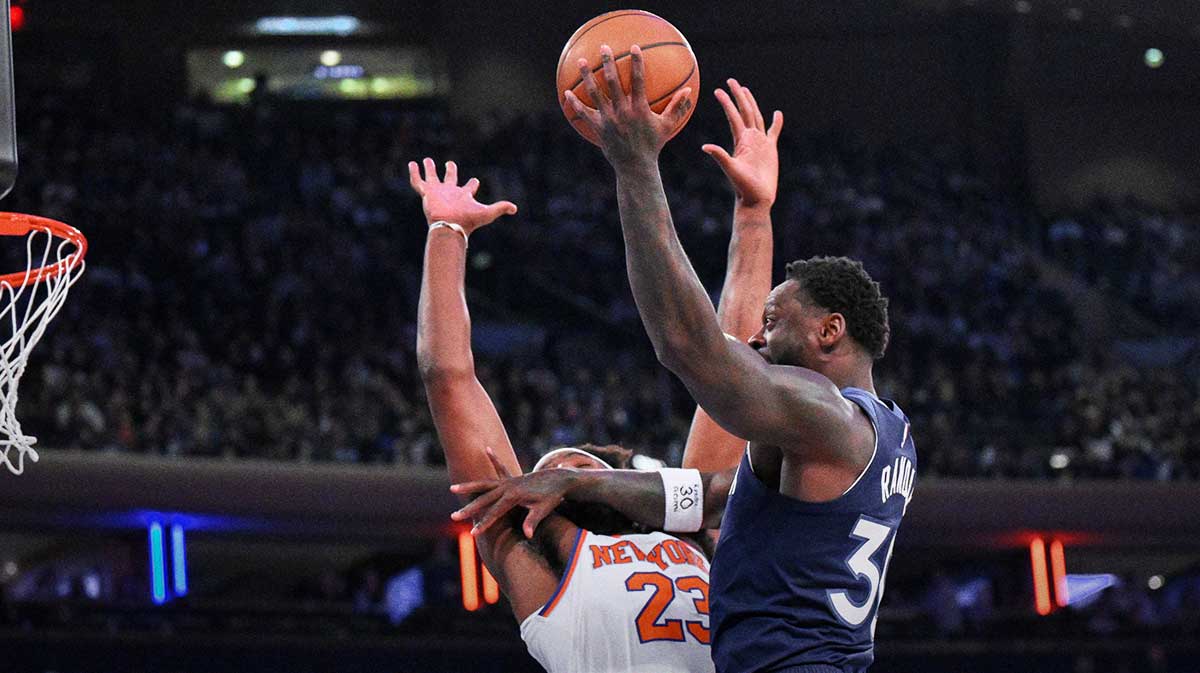 Minnesota Timberwolves forward/center Julius Randle (30) shoots the ball while defended by New York Knicks center/forward Mitchell Robinson (23) during the first half at Madison Square Garden.