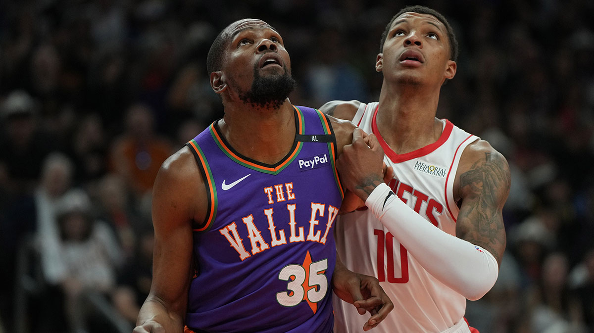 Phoenix Suns forward Kevin Durant (35) and Houston Rockets forward Jabari Smith Jr. (10) fight for position in the first half at Footprint Center.