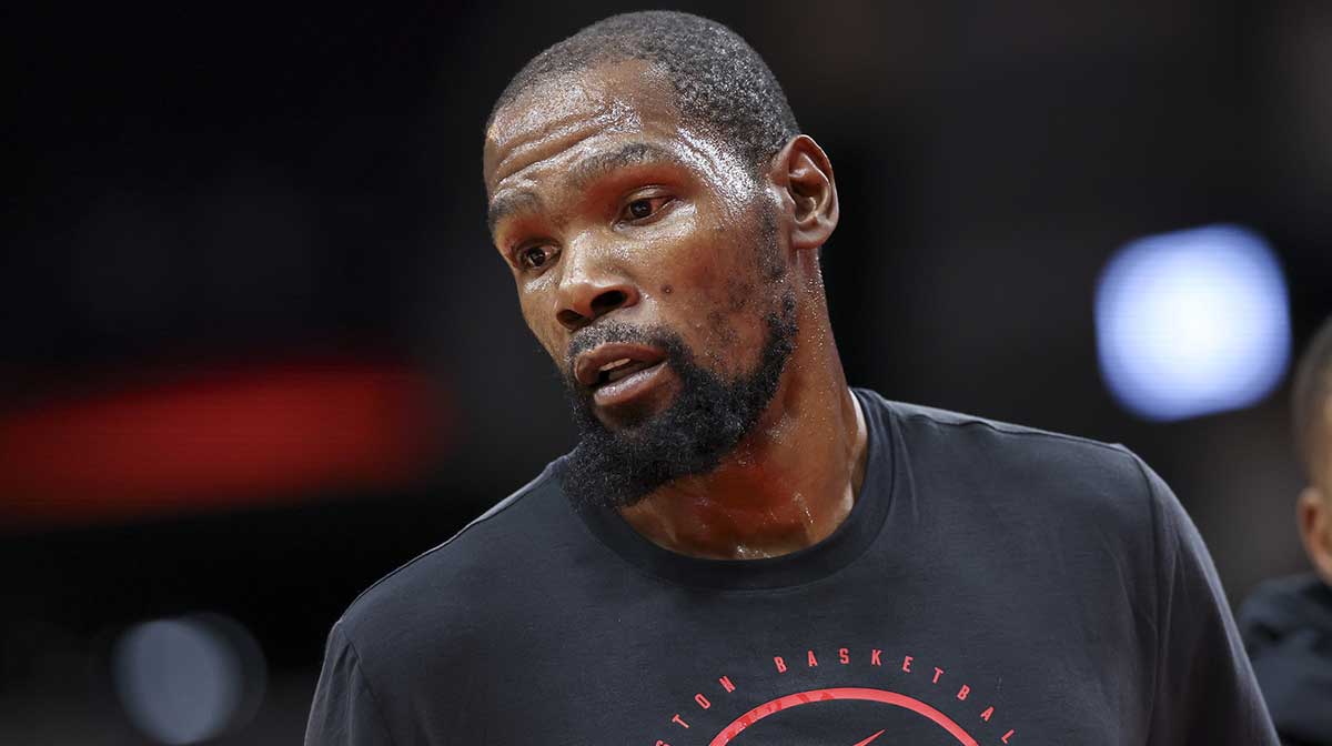 Rockets forward Kevin Durant (7) warms up before the game against the Atlanta Hawks at Toyota Center with Thunder logo in the background