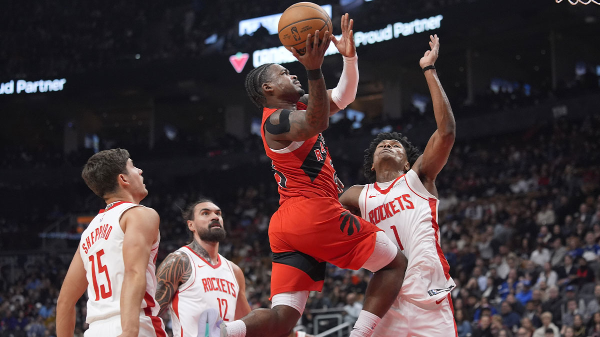 Toronto Raptors forward Ochai Agbaji (30) goes up to make a basket against Houston Rockets forward Amen Thompson (1) during the first half at Scotiabank Arena.