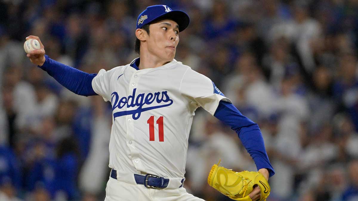Los Angeles Dodgers pitcher Roki Sasaki (11) throws a pitch against the Cincinnati Reds in the ninth inning during game two of the Wildcard round for the 2025 MLB playoffs at Dodger Stadium.