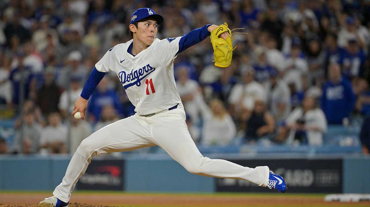 Los Angeles Dodgers pitcher Roki Sasaki (11) throws a pitch against the Cincinnati Reds in the ninth inning during game two of the Wildcard round for the 2025 MLB playoffs at Dodger Stadium.