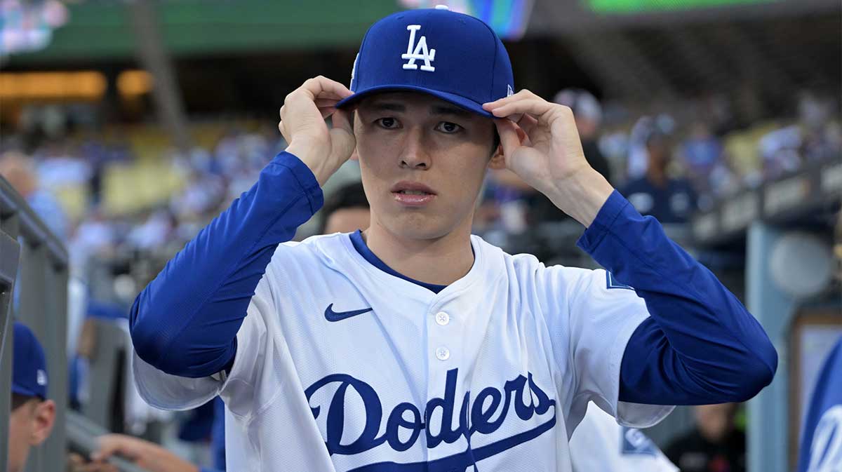 Los Angeles Dodgers starting pitcher Roki Sasaki (11) in the dugout prior to game one of the Wildcard round for the 2025 MLB playoffs against the Cincinnati Reds at Dodger Stadium.