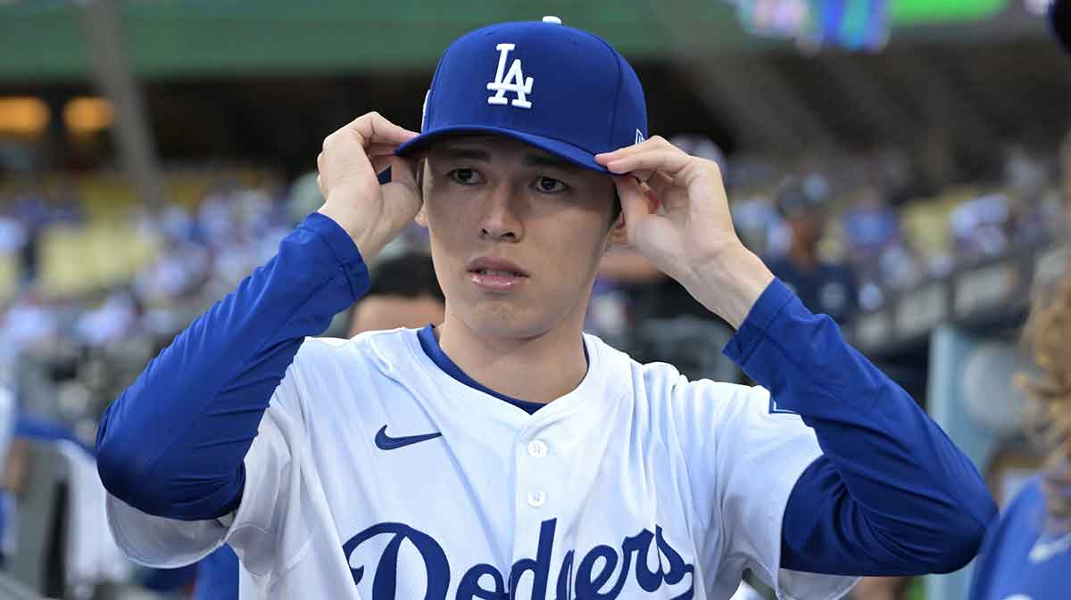 Los Angeles Dodgers starting pitcher Roki Sasaki (11) in the dugout prior to game one of the Wildcard round for the 2025 MLB playoffs against the Cincinnati Reds at Dodger Stadium.