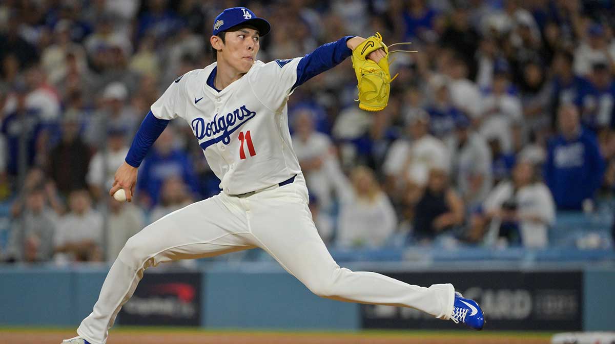 Los Angeles Dodgers pitcher Roki Sasaki (11) throws a pitch against the Cincinnati Reds in the ninth inning during game two of the Wildcard round for the 2025 MLB playoffs at Dodger Stadium.