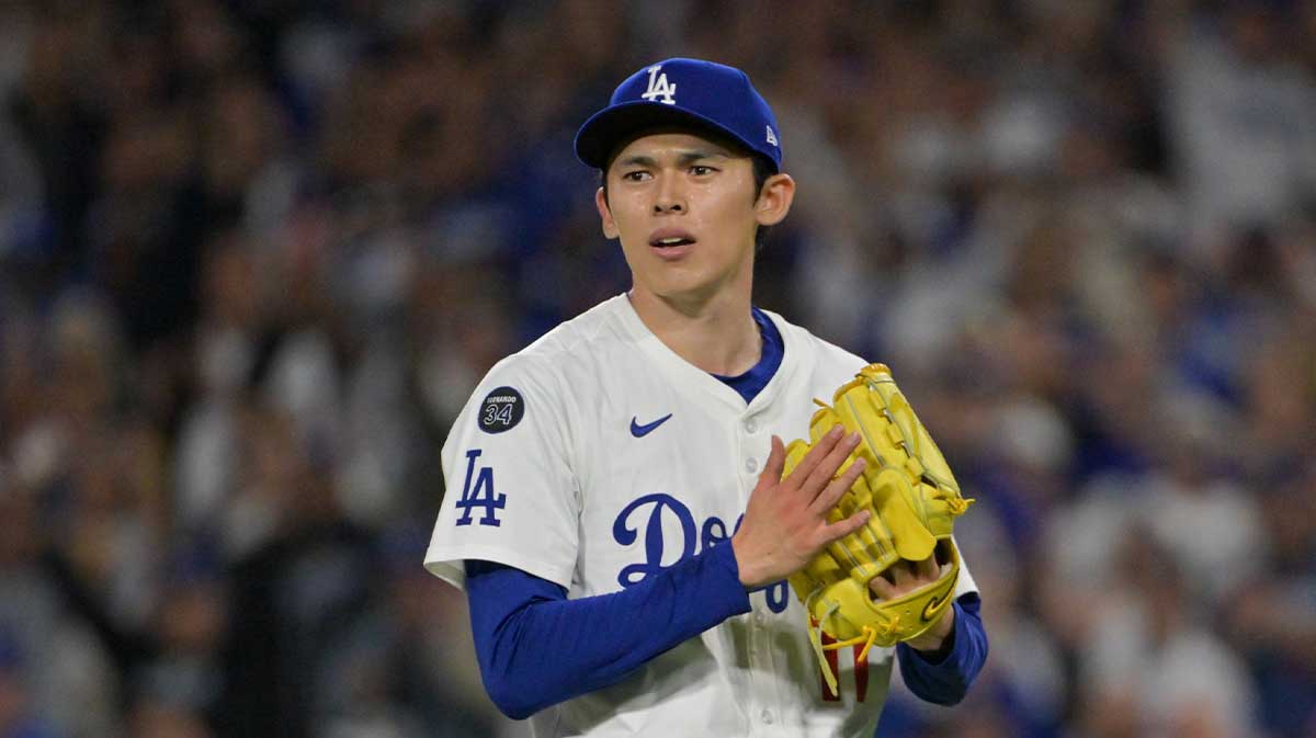 Los Angeles Dodgers pitcher Roki Sasaki (11) reacts to the final out against the Cincinnati Reds during game two of the Wildcard round for the 2025 MLB playoffs at Dodger Stadium.