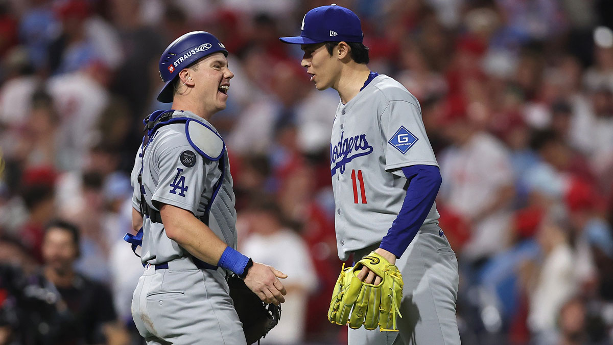 Los Angeles Dodgers pitcher Roki Sasaki (11) and catcher Will Smith (16) celebrate after defeating the Philadelphia Phillies in game one of the NLDS round for the 2025 MLB playoffs at Citizens Bank Park. 