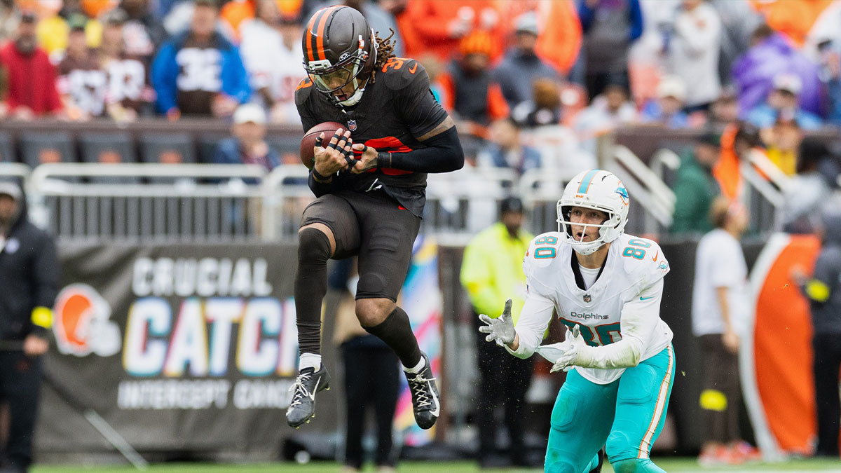 Cleveland Browns safety Ronnie Hickman Jr. (33) intercepts a pass intended for Miami Dolphins tight end Tanner Conner (80) during the fourth quarter at Huntington Bank Field.