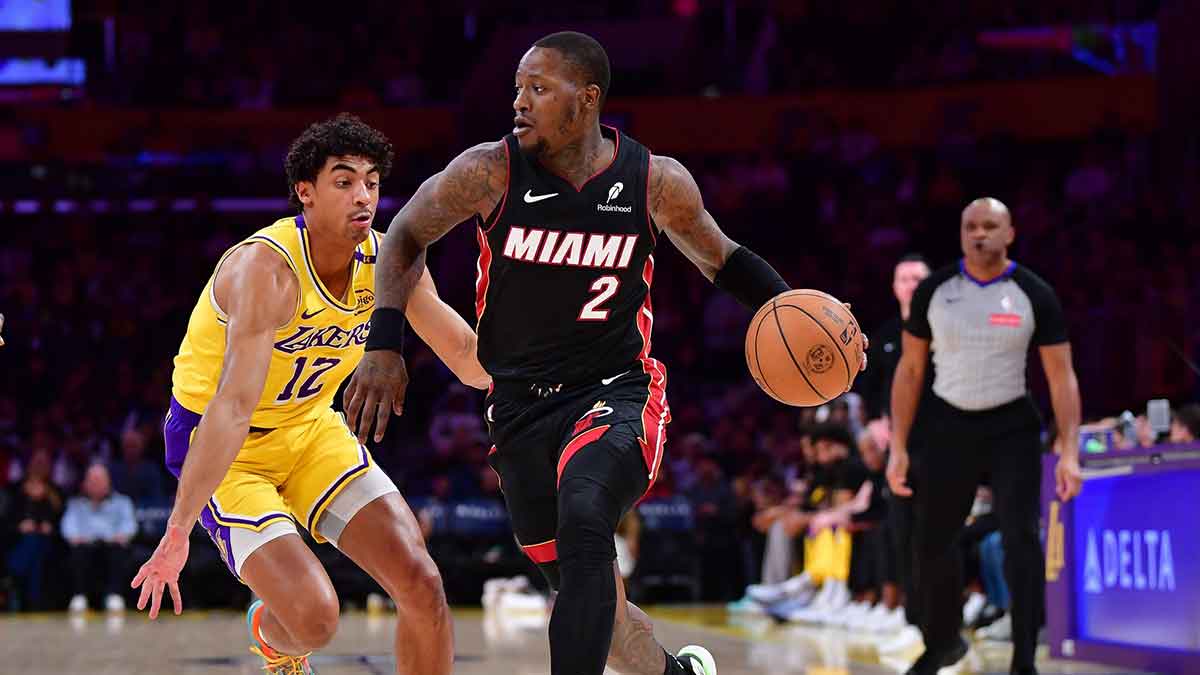 Miami Heat guard Terry Rozier (2) moves the ball against Los Angeles Lakers guard Max Christie (12) during the first half at Crypto.com Arena.