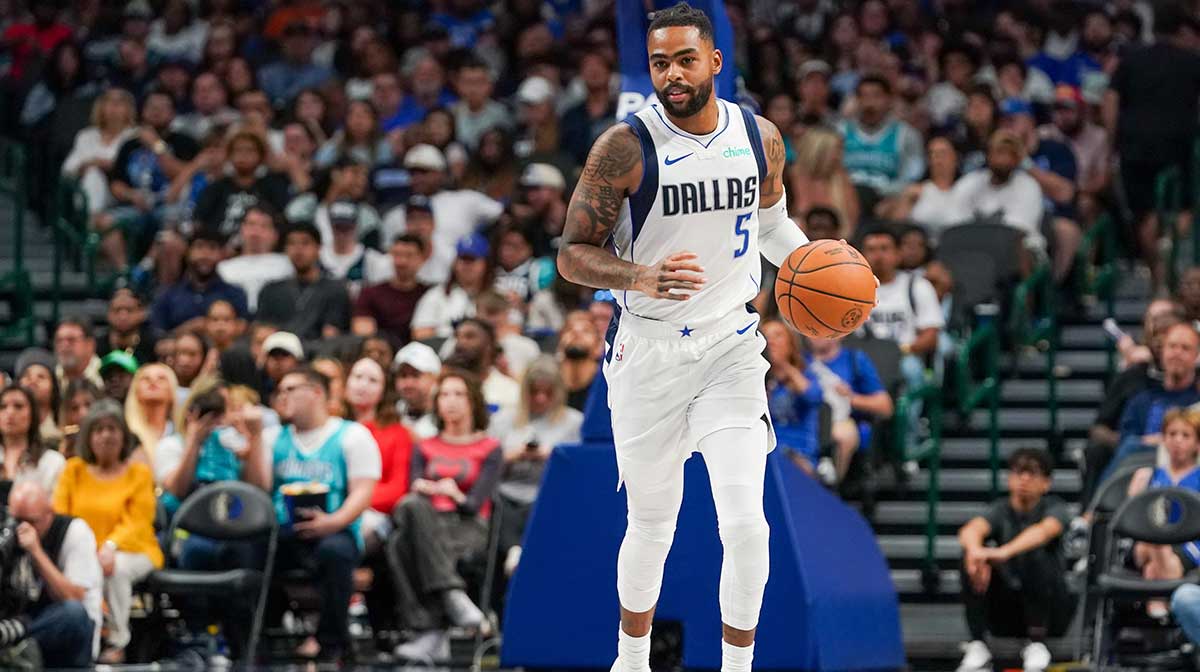 Dallas Mavericks guard D'Angelo Russell (5) brings the ball up court in the second half of a game against the Charlotte Hornets at American Airlines Center.