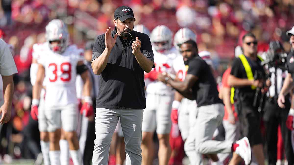 Ohio State Buckeyes head coach Ryan Day reacts in warm ups before the game against the Wisconsin Badgers at Camp Randall Stadium.