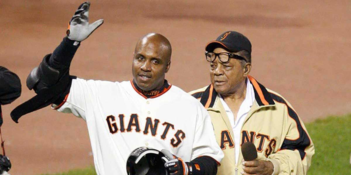 San Francisco Giants Barry Bonds is treated by Willie Mays after hitting home run number 756 off Washington Nationals pitcher Mike Bacsik breaking Hank Aaron's all-time Major League Baseball career home run record of 755 on Aug. 7, 2007 at AT&T Park in San Francisco, CA becoming the career all-time home run record holder. © Jack Gruber / USA TODAY NETWORK