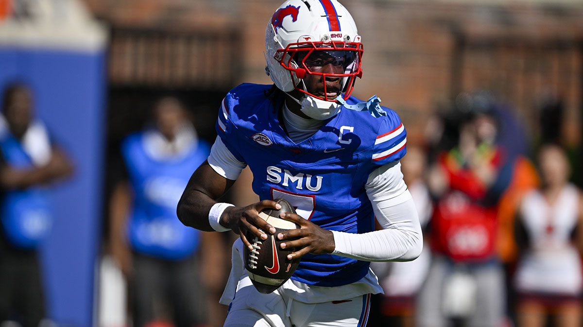 Oct 4, 2025; Dallas, Texas, USA; SMU Mustangs quarterback Kevin Jennings (7) rolls out with the ball during the first half against the Syracuse Orange at Gerald J. Ford Stadium. Mandatory Credit: Jerome Miron-Imagn Images