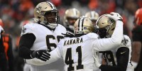 New Orleans Saints running back Alvin Kamara (41) celebrates with guard Josh Andrews (68) and wide receiver Rashid Shaheed (89) after scoring during the second half against the Cleveland Browns at FirstEnergy Stadium